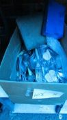 A box of miscellaneous cutlery