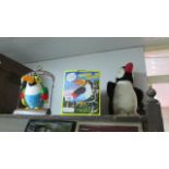 A talking toy parrot and other toys