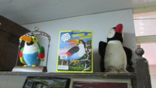 A talking toy parrot and other toys
