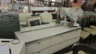 A white 6 drawer dressing table with stool