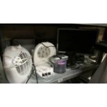 A shelf of electrical items including fan heaters