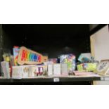 A shelf of new items including toys