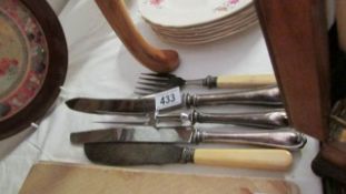 A quantity of carving knives and forks