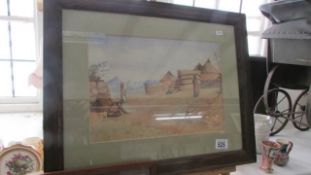 A framed and glazed watercolour, African village scene, signed F H Dutton