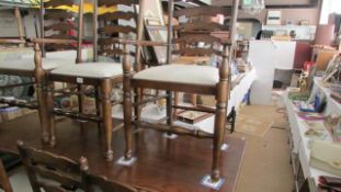 An oak dining table and 6 chairs