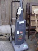 A Hitachi vacuum and a trolley bag