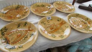 A set of 6 studio pottery fish decorated plates