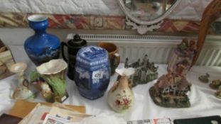 A mixed lot including blue and white jar, cottages etc
