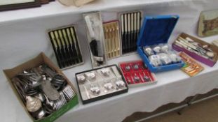 A quantity of cased cutlery sets etc