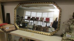 A gilt framed mirror