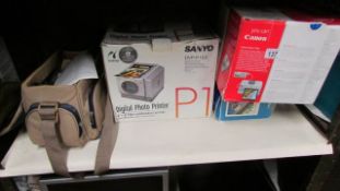 A Sanyo photo printer, one other, video recorder etc