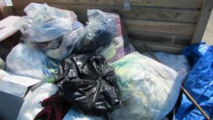 A large quantity of bags of clothes and curtains