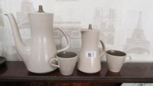 A Poole coffee pot, jug and 2 tea cups