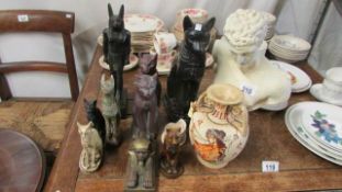 A quantity of Egyptian cat figures etc