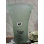 A large green glass vase