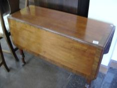 A mahogany drop leaf table