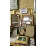 A quantity of picture frames and mirrors