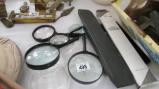 A quantity of magnifying glasses and maths sets
