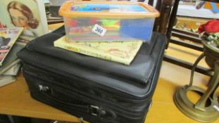 A travel case and craft items