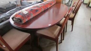 A mahogany dining table and 4 chairs
