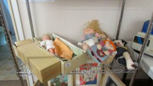 A shelf of vintage dolls