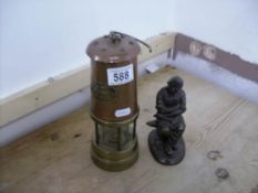 A Davy lamp and a blacksmith figure