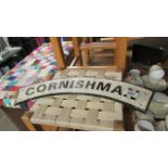 A curved cast iron 'Cornishman' sign
