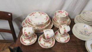 A Royal Doulton rose pattern tea and dinner set