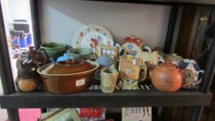 A shelf of teapots etc