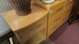 A modern 6 drawer chest and matching bedside