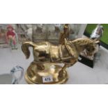 A brass horse and a brass figure with dog