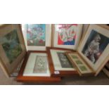 A shelf of framed and glazed prints