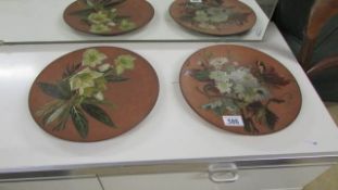 A pair of Watcombe pottery hand painted plaques