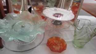 A quantity of glass and china cake stands etc