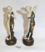 A pair of semi nude figures