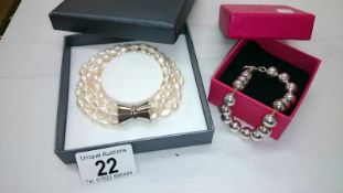 A freshwater pearl 4 strand bracelet & 1 other
