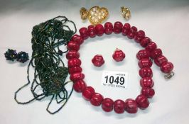 Heavy coral necklace with matching earrings,
