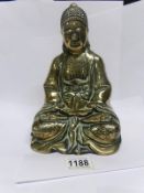 A 19th century brass Buddha