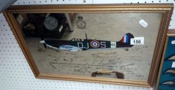 A picture mirror of a Spitfire with WWII fighter pilots signatures