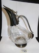 A glass 'Duck' shaped claret jug with plated fittings