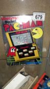 A boxed 1980's grandstand pocket Pacman