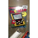 A boxed 1980's grandstand pocket Pacman