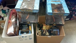 A collection of Lord of the Rings toys and collectibles