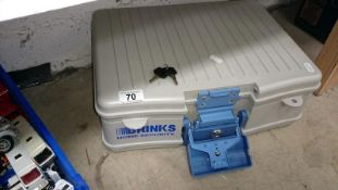 A Brinks home security case with key