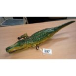 1950's tinplate clockwork crocodile with native riding on its back