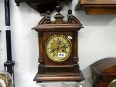 A Victorian oak mantel clock