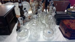 A collection of 9 crystal glass decanters inc.
