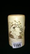 An ivory vase with carved scene on front and Chinese text on reverse