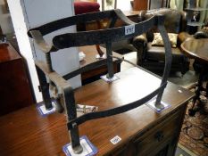 An adjustable wrought iron barrel stand
