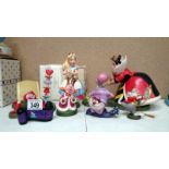 A collectioin of boxed WDCC Alice in Wonderland figures inc. Alice, Queen, King etc.